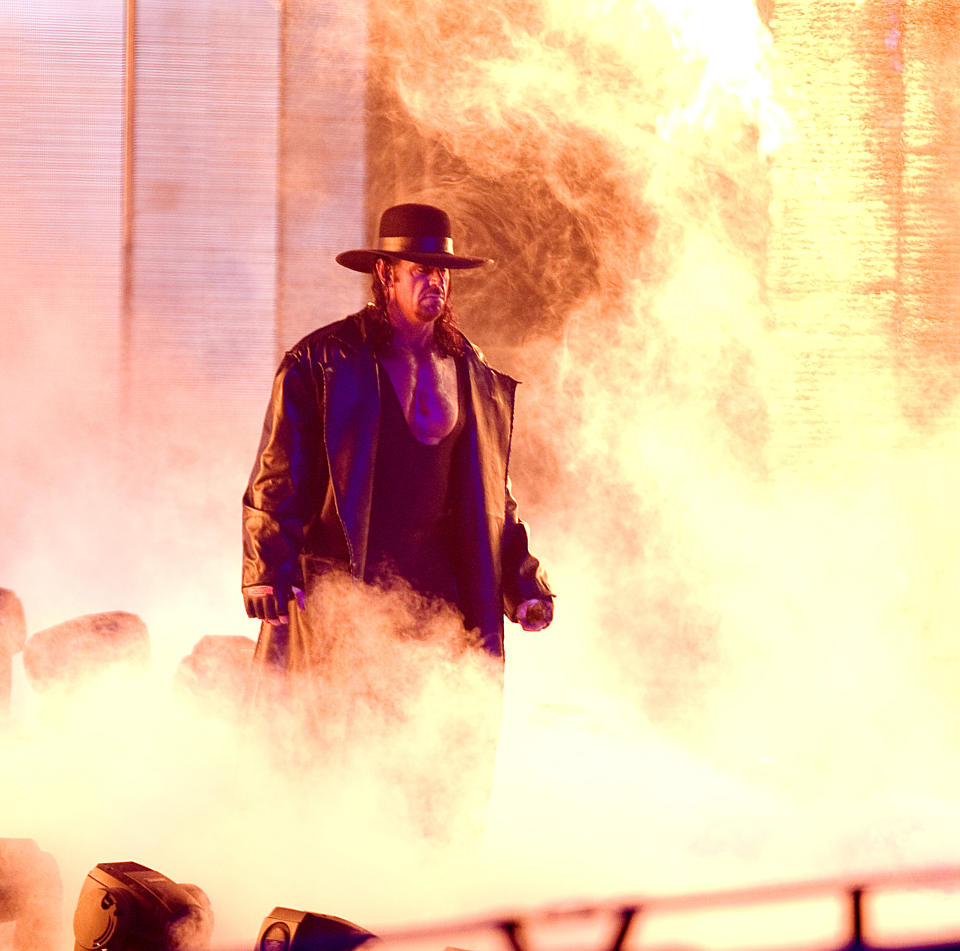 The Undertaker makes his way to the ring in smoke.