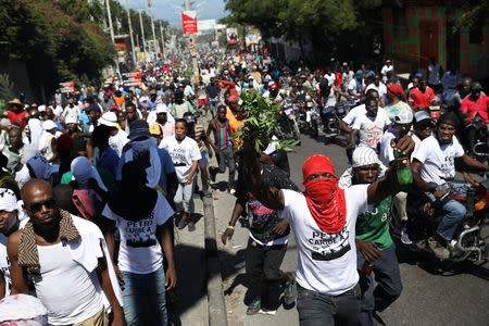 Protesters march to demand an investigation into what they say is the alleged misuse of Venezuela-sponsored PetroCaribe funds, in Port-au-Prince, Haiti, October 17, 2018. REUTERS/Andres Martinez Casares