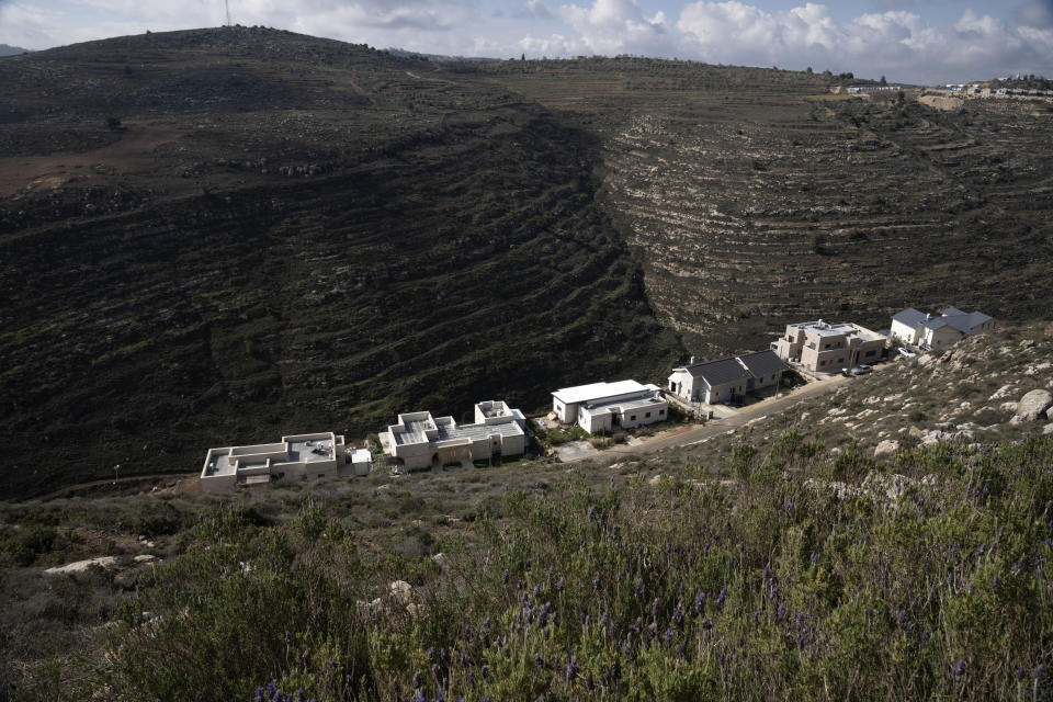 Houses sit on a hill at the West Bank outpost of Givat Harel, Thursday, Feb. 16, 2023. Israel's new ultranationalist government declared last week that it would legalize 10 unauthorized outposts in the occupied West Bank. The rare move intensified the country's defiance of international pressure and opened an aggressive new front of Israeli expansion into the West Bank, which Israel captured in the 1967 Mideast war. (AP Photo/ Maya Alleruzzo)
