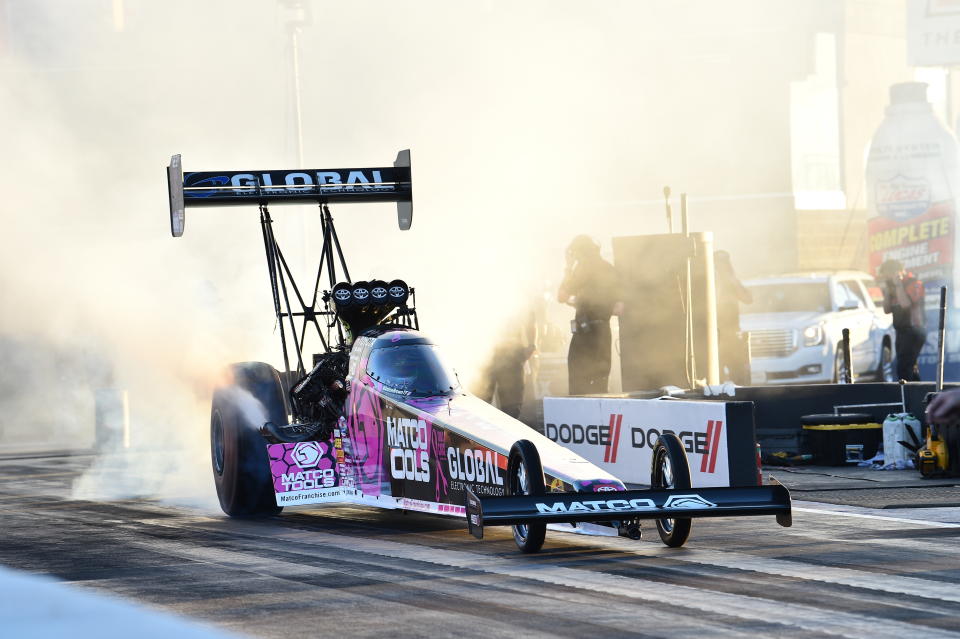 In this photo provided by the NHRA, Top Fuel's Antron Brown scored his first win since 2018 when he took down the 2020 champions Steve Torrence with his 3.740-second run at 322.19 mph to cap off the Dodge NHRA Finals presented by Pennzoil, Sunday, Nov. 1, 2020, in Las Vegas. (Jerry Foss/NHRA via AP)