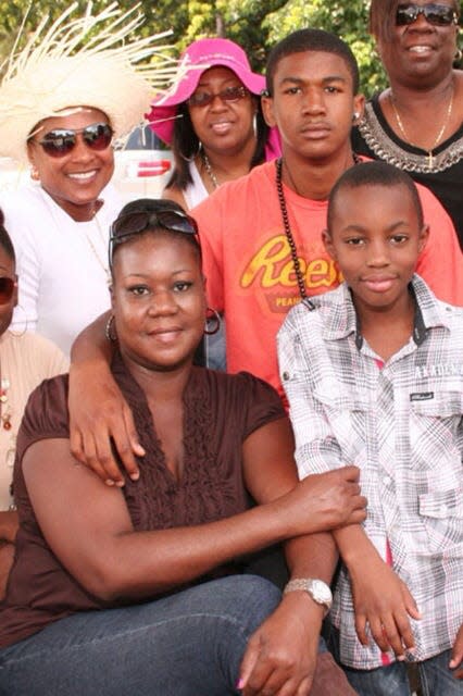 Trayvon Martin, 17, in the orange shirt, was with his family eight days before his death.