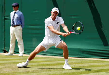 FILE PHOTO: Tennis - Wimbledon - All England Lawn Tennis and Croquet Club, London, Britain - July 4, 2018 Australia's John Millman in action during the second round match against Croatia's Milos Raonic REUTERS/Andrew Boyers