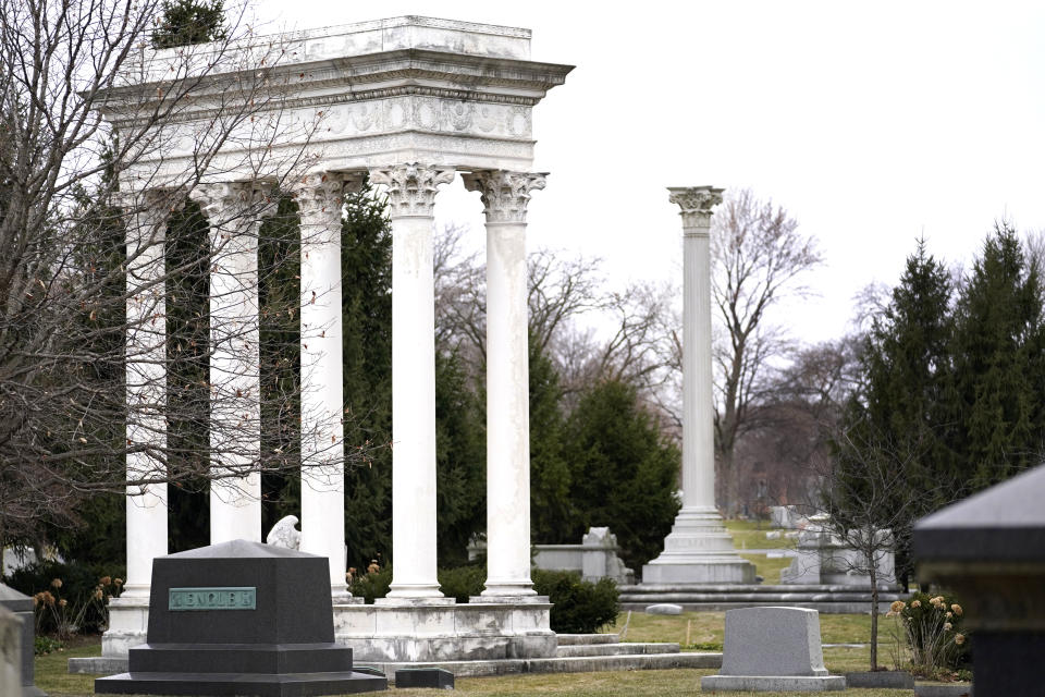 The towering burial monuments for William Kimball, left, the piano, reed and pipe organ manufacturer, and George Pullman, right, renowned for his luxury railcars, rise high in the deepest section of Graceland Cemetery, on Chicago's Northside Monday, March 15, 2021. Graceland quickly became the preeminent place of burial for Chicago's elite starting in the late 1800's. (AP Photo/Charles Rex Arbogast)