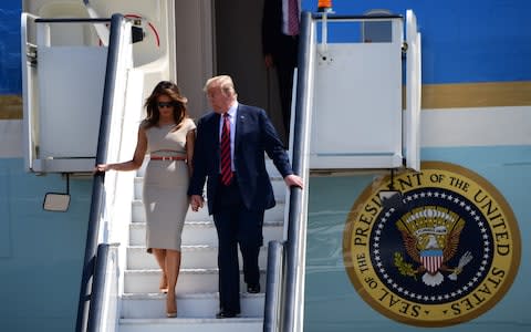 President Trump and his wife, Melania, hold hands as they leave Air Force One - Credit: PAUL GROVER FOR THe TELEGRAPH 