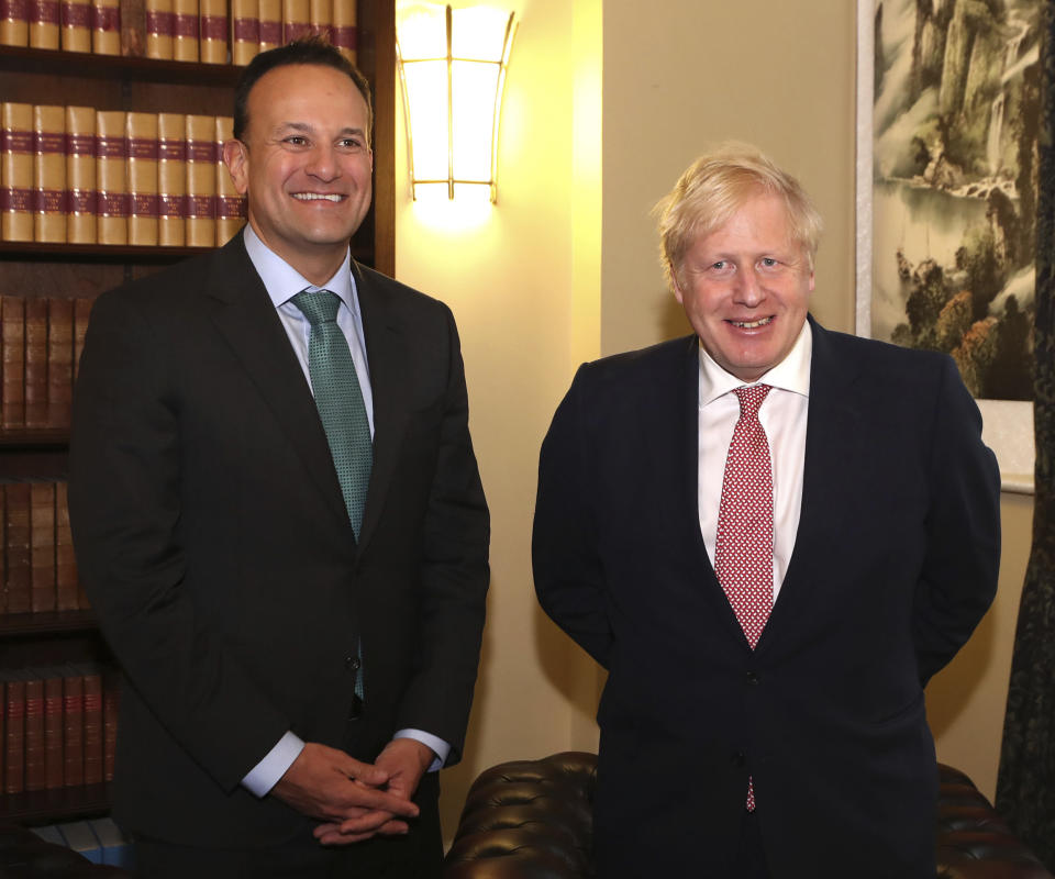 Ireland's Taoiseach Leo Varadkar, left, poses for a photo with Britain's Prime Minister, Boris Johnson, during their meeting at the Parliament Buildings, in Stormont, Belfast, Northern Ireland, Monday,  Jan. 13, 2020. (Liam McBurney/PA via AP)