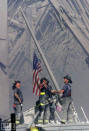 This image, made by Bergen Record photographer Thomas E. Franklin on the day of the attacks, eerily calls to mind one of American history's most iconic pictures: Joe Rosenthal's 1945 photograph of five Marines and a Navy corpsman raising the Stars and Stripes at Iwo Jima. <br><br>(Photo: 2001 The Record (Bergen County, N.J.) Thomas E. Franklin)<br><br>For the full photo collection, go to <a href="http://www.life.com/gallery/59971/911-the-25-most-powerful-photos#index/0" rel="nofollow noopener" target="_blank" data-ylk="slk:LIFE.com;elm:context_link;itc:0;sec:content-canvas" class="link ">LIFE.com</a>