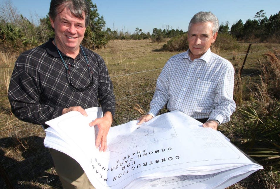 Real estate consultant David Lusby, left, and Joe Mannarino, the then-economic development director for the City of Ormond Beach, are seen on the site of the long-planned Ormond Crossings mixed-use development in Ormond Beach in 2015. The 3,000-acres on the south side of U.S. 1 on both sides of Interstate 95 is under contract to be sold to a developer from Maryland, Lusby confirmed on Dec. 20, 2023. The sale is expected to close by the end of December.