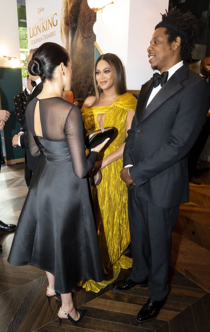 Beyonce and Jay-Z chat with Meghan Markle at the London premiere of “The Lion King” live-action remake. - Credit: Shutterstock
