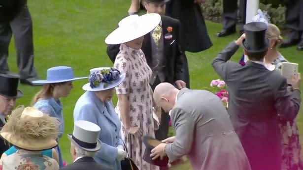 Mike Tindall removed his top hat as he greeted the Queen and made her laugh with his pre-planned gag.