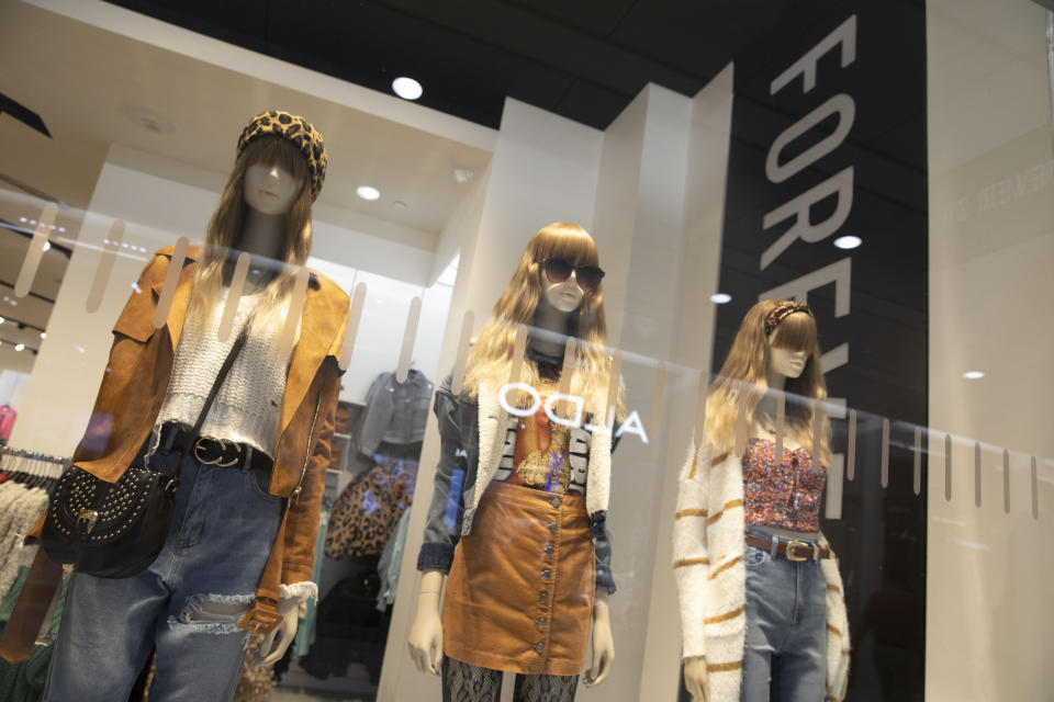 Fashions are displayed in the window of a Forever 21 clothing store, Monday, Sept. 30, 2019, in New York. Low-price fashion chain Forever 21, a one-time hot destination for teen shoppers that fell victim to its own rapid expansion and changing consumer tastes, has filed for Chapter 11 bankruptcy protection. (AP Photo/Mark Lennihan)