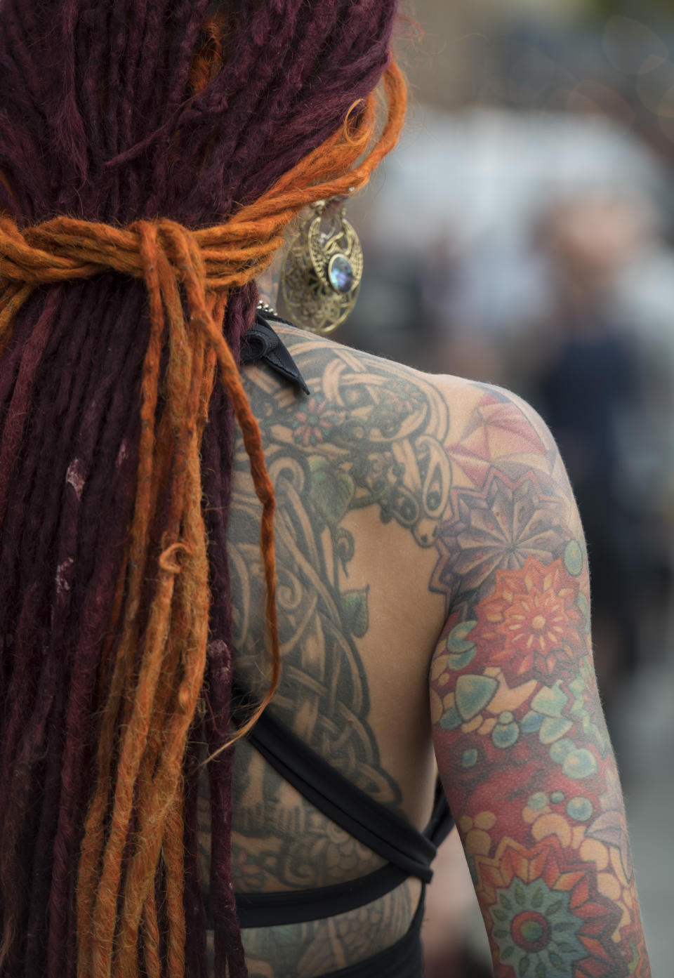 <p>A visitor with her tattooed arm and back at the London Tattoo convention at Tobacco Dock on Sept. 23, 2017 in London, England. (Photo: James D. Morgan/Getty Images) </p>