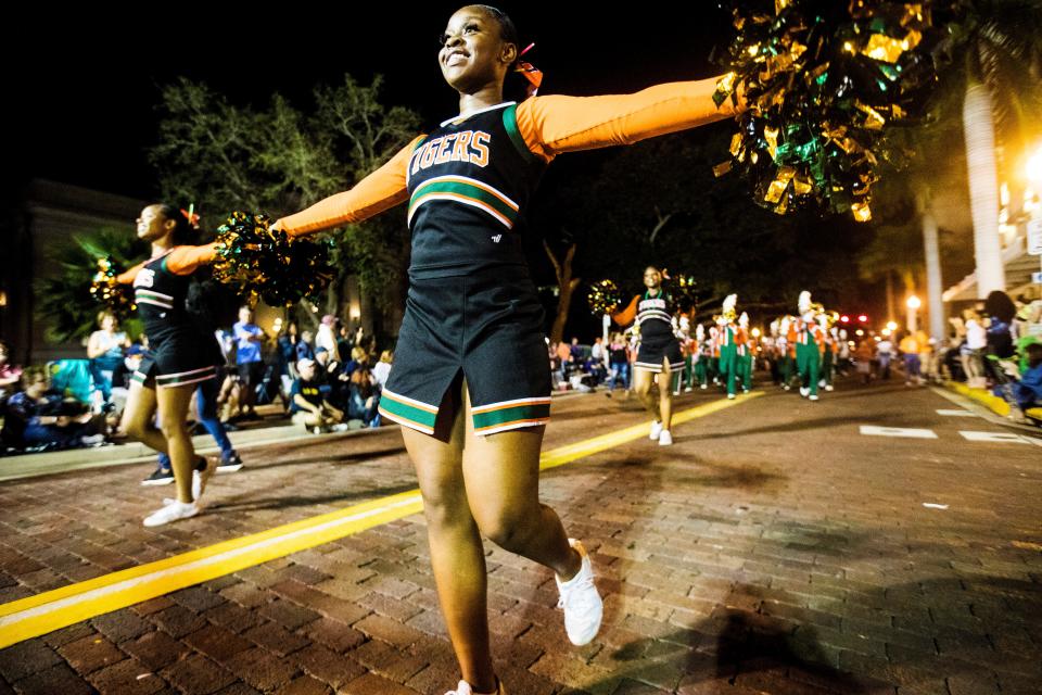 Members of the Dunbar High School Marching Band participate in The Edison Festival of Light Grand Parade in downtown Fort Myers on Saturday Feb. 15, 2020.