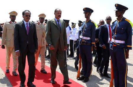 Eritrea's President Isaias Afwerki is welcomed by Somalia's President Mohamed Abdullahi Mohamed as he arrives at the Aden Abdulle International Airport in Mogadishu, Somalia December 13, 2018. REUTERS/Feisal Omar