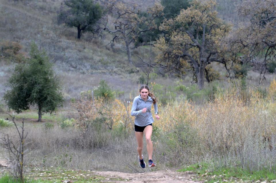 Oaks Christian School's Payton Godsey goes for a run Cheeseboro Canyon Trail in Agoura Hills on Thursday, Dec. 15, 2022. Godsey was basically unbeatable when she stepped onto a cross country course in her junior season.