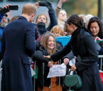 <p>Prince Harry and Meghan Markle meet a girl holding a sign saying “My name is Megan too” on a visit to Cardiff, Wales. (Photo by Max Mumby/Indigo/Getty Images) </p>