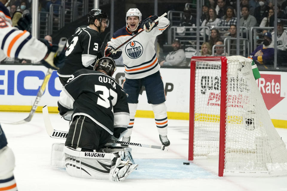 Edmonton Oilers left wing Zach Hyman, right, celebrates his power play as Los Angeles Kings goaltender Jonathan Quick, below sits in goal and defenseman Matt Roy skates by during the first period in Game 3 of an NHL hockey Stanley Cup first-round playoff series Friday, May 6, 2022, in Los Angeles. (AP Photo/Mark J. Terrill)