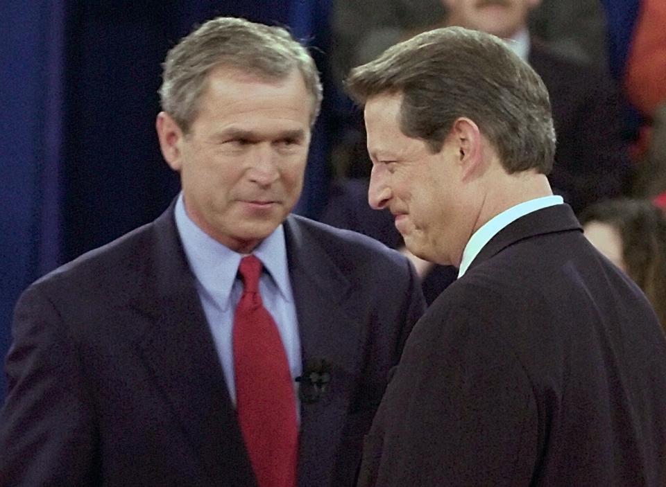 Texas Gov. George W. Bush greets Vice President Al Gore at Washington University in St. Louis on Oct. 17, 2000.