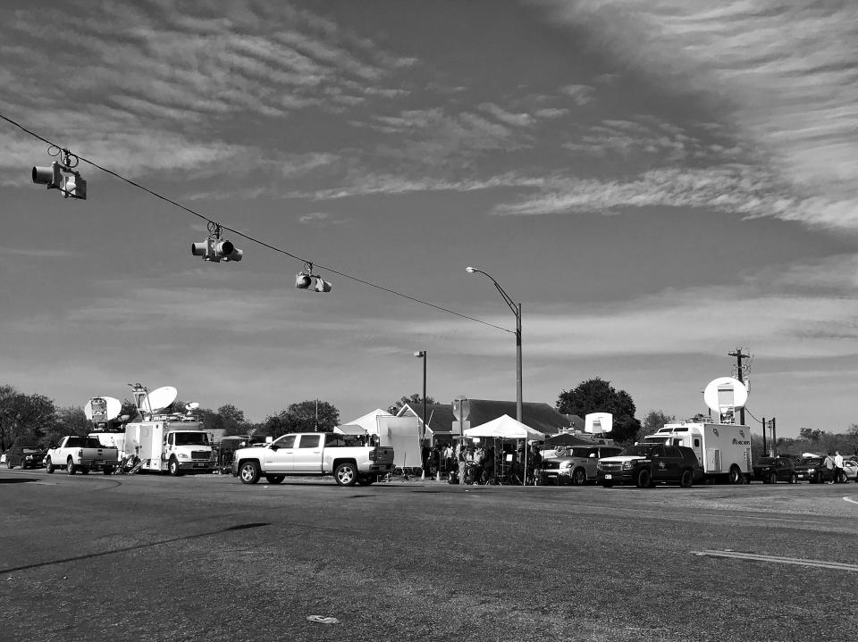 Media trucks crowd the only major intersection in Sutherland Springs, Texas, a tiny one-stoplight town that was the site of a mass shooting on Sunday. (Photo: Holly Bailey/Yahoo News)