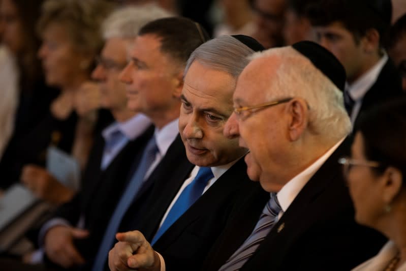 Israeli Prime Minister Benjamin Netanyahu and Israel's president, Reuven Rivlin take part in a memorial ceremony held at the supreme court honouring former Supreme Court president Meir Shamgar who died on Saturday in Jerusalem