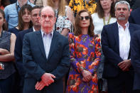 <p>Pierre Lescure, Cannes Film Festival president, centre left, and actress Isabelle Huppert, centre right, join staff to hold a moment of silence on the steps of the Palais du Festival, Tuesday, May 23, 2017 for the victims of the Manchester bomb blast. An apparent suicide bomber attacked an Ariana Grande concert as it ended Monday night, killing over a dozen people among a panicked crowd of young concertgoers, in Manchester, England. (AP Photo/Thibault Camus) </p>