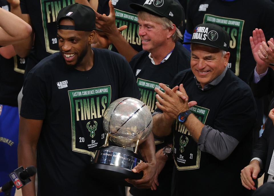 Khris Middleton of the Milwaukee Bucks holds the Eastern Conference Championship trophy after defeating the Atlanta Hawks in Game Six of the Eastern Conference Finals at State Farm Arena on July 03, 2021, in Atlanta, Georgia.