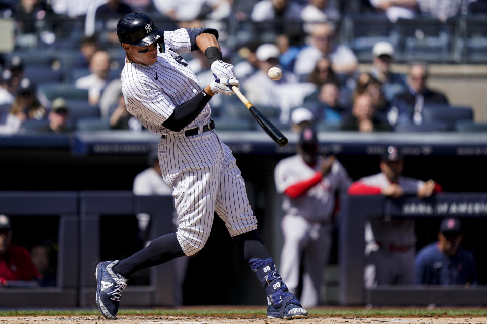 New York Yankees' Aaron Judge hits a single off Boston Red Sox starting pitcher Nathan Eovaldi in the first inning of an opening day baseball game, Friday, April 8, 2022, in New York. (AP Photo/John Minchillo)