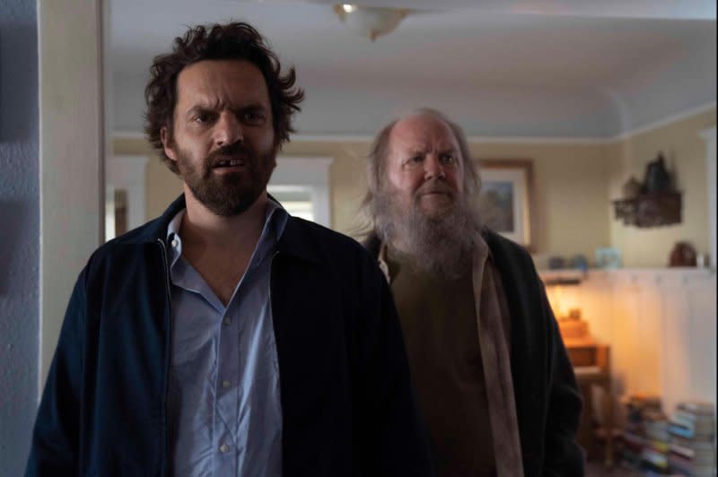 Tommy (Jake Johnson, L) hires a homeless man (Biff Liff) to protect him from assassins. Photo courtesy of Hulu