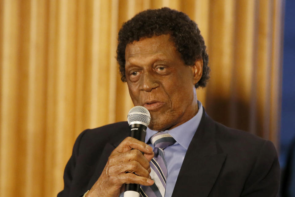 FILE - NBA Hall of Famer Elgin Baylor speaks at an event before an NBA basketball game between the Los Angeles Clippers and the Dallas Mavericks in Los Angeles, in this Monday, Feb. 25, 2019, file photo. Elgin Baylor, the Lakers’ 11-time NBA All-Star, died Monday, March 22, 2021, of natural causes. He was 86. The Lakers announced that Baylor died in Los Angeles with his wife, Elaine, and daughter Krystal by his side.(AP Photo/Alex Gallardo)