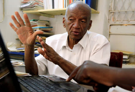 Ali Mohamed Othman, a 69-year-old professor at the Sudan University of Science and Technology discusses a project with a student in Khartoum, Sudan February 11, 2019. Picture taken February 11, 2019. REUTERS/Mohamed Nureldin Abdallah