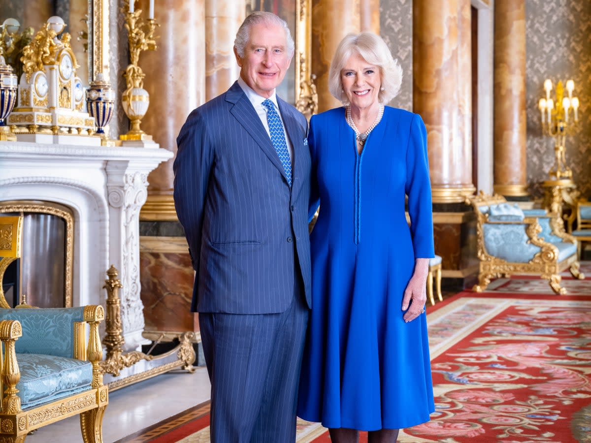 Handout photo issued by Buckingham Palace of King Charles III and the Queen Consort taken by Hugo Burnand in the Blue Drawing Room at Buckingham Palace, London (PA/Hugo Burnand)