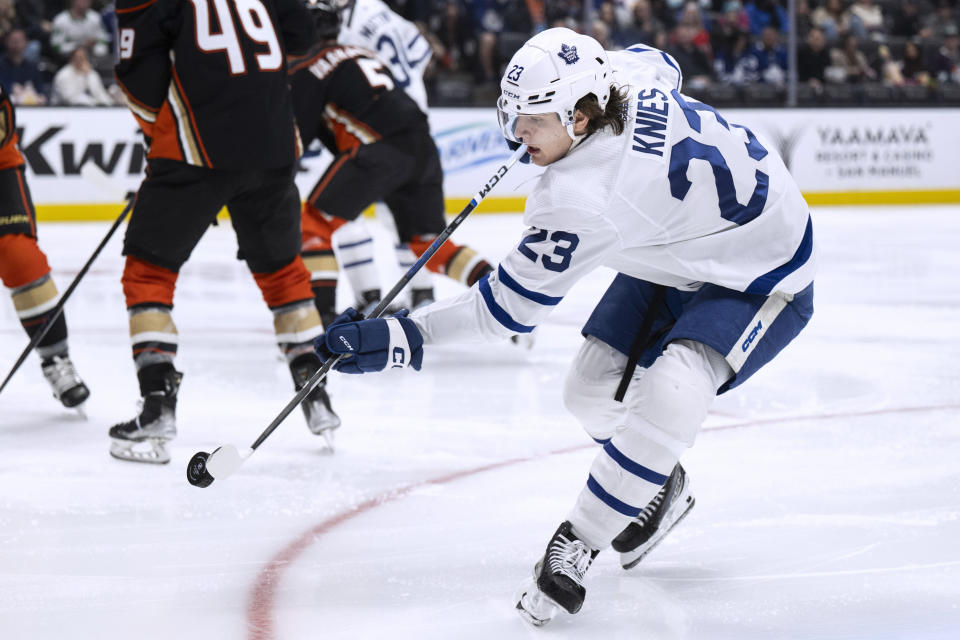 Toronto Maple Leafs left wing Matthew Knies (23) shoots against the Anaheim Ducks during the second period of an NHL hockey game Wednesday, Jan. 3, 2024, in Anaheim, Calif. (AP Photo/Kyusung Gong)