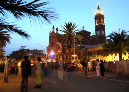 Eritreans gather in front of the Catholic Cathedral in the capital, Asmara, June 19, 2005, on the eve of Martyrs' Day to remember those who gave their lives to win independence. REUTERS/Ed Harris/File Photo