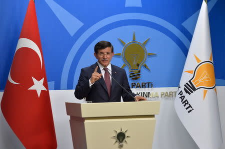 Turkey's Prime Minister Ahmet Davutoglu speaks during a news conference at his ruling AK Party (AKP) headquarters in Ankara, Turkey, August 13, 2015. REUTERS/Stringer