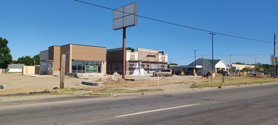 Work proceeds this week on a Starbucks, center, and a WellNow Urgent Care, right, along South Centerville Road.