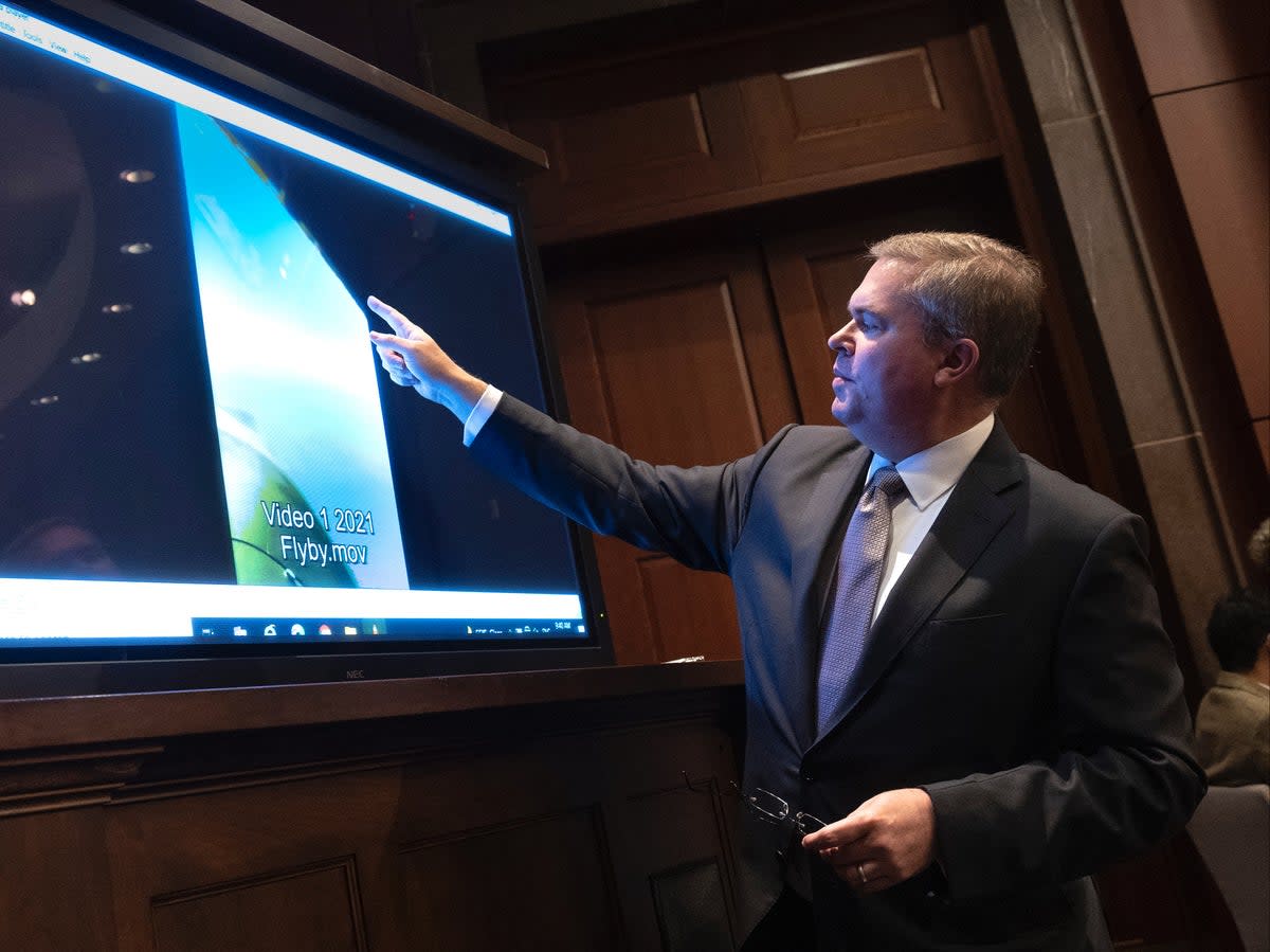 US Deputy Director of Naval Intelligence Scott Bray explains a video of an unidentified aerial phenomena during a committee hearing in May 2022  (Getty Images)