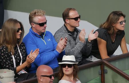 Amelie Mauresmo (R), former French tennis player and Britain's Andy Murray's coach follows his men's singles match against Facundo Arguello of Argentina at the French Open tennis tournament at the Roland Garros stadium in Paris, France, May 25, 2015. REUTERS/Jean-Paul Pelissier