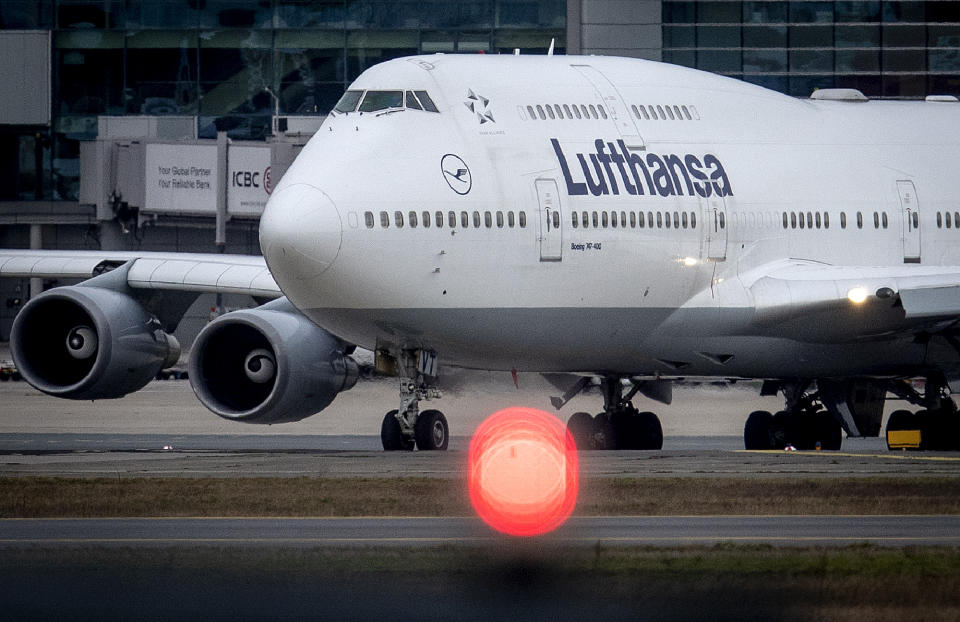 A Boeing 747 of Lufthansa rolls over the runway at the airport in Frankfurt, Germany, Sunday, March 1, 2020. The aviation industry expects heavy financial losses due to the Covid-19 virus. (AP Photo/Michael Probst)