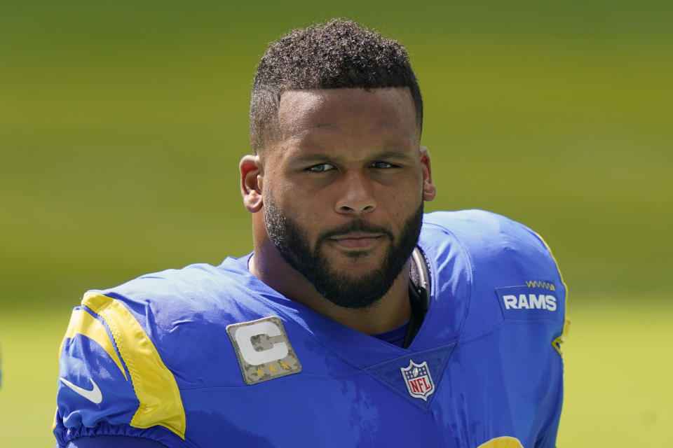 FILE - Los Angeles Rams defensive end Aaron Donald (99) stands on the sidelines during the first half of an NFL football game against the Miami Dolphins in Miami Gardens, Fla., in this Sunday, Nov. 1, 2020, file photo. Dynamic defensive star Aaron Donald and unstoppable tight end Travis Kelce are unanimous choices Friday, Jan. 8, 2021, for The Associated Press NFL All-Pro Team. (AP Photo/Lynne Sladky, File)