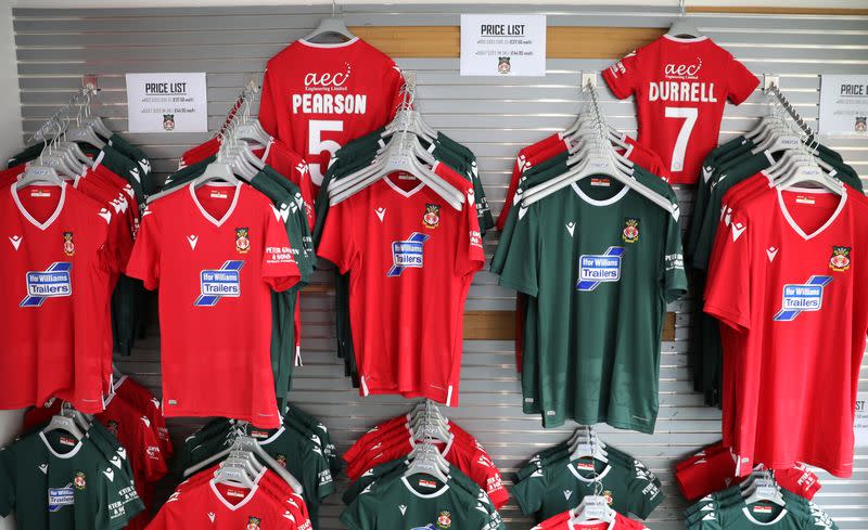 Club shirts are seen for sale at The Racecourse stadium, the home of Wrexham Football Club, in Wrexham, Britain