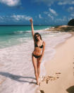 <p>Cindy Crawford's lookalike model daughter, Kaia, has an impromptu photo session on the beach, during the family's vacation in Miami.</p>