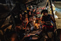 ALCALA, PHILIPPINES - NOVEMBER 16: Residents whose homes were destroyed by Typhoon Vamco stay in makeshift tents along a highway on November 16, 2020 in Alcala, Cagayan province, Philippines. The Cagayan Valley region in northern Philippines saw its worst flooding in 48 years after a dam released massive amounts of rainwater brought about by Typhoon Vamco. The country continues to reel from the widespread destruction caused by this year's deadliest cyclone which has killed at least 67 people. (Photo by Ezra Acayan/Getty Images)