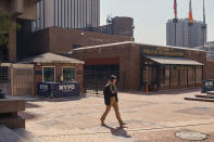 A woman walks outside One Police Plaza NYPD Headquarters on Friday, Sept. 13, 2024, in New York. (AP Photo/Andres Kudacki)