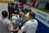 Police personnel detain an activist from a farmers rights organisation during a protest following the recent passing of agriculture bills in the Lok Sabha (lower house), in Bangalore on September 25, 2020. (Photo by Manjunath Kiran / AFP) (Photo by MANJUNATH KIRAN/AFP via Getty Images)