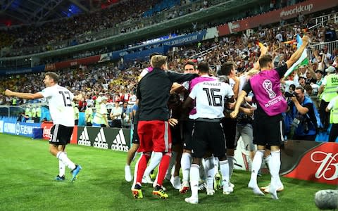 Wild celebrations are sparked by Toni Kroos' winning goal - Credit: REUTERS