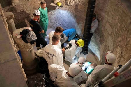 Experts open the ossuary at the Teutonic Cemetery at the Vatican