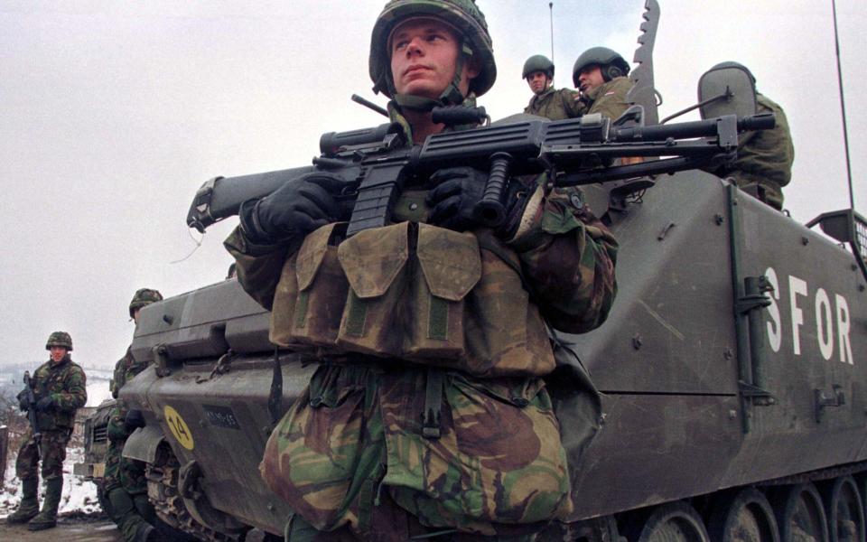 A Dutch soldier of the Nato-led peacekeeping force in Bosnia - Credit: Damir Sagolj REUTERS