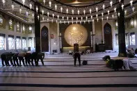Men pray at Katara "blue" mosque, in Doha, Qatar, Thursday, Nov. 24, 2022. (AP Photo/IJorge Saenz)