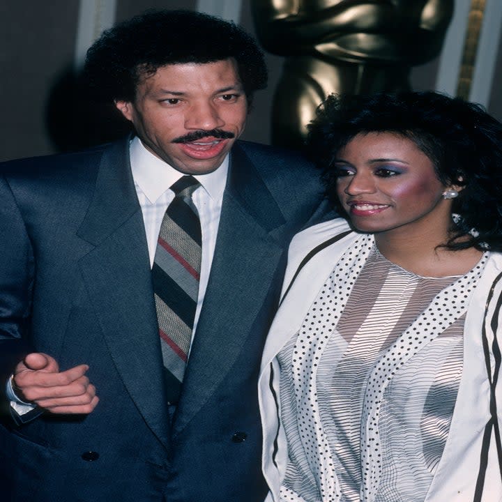 Lionel Richie and Brenda Harvey attend the nominees luncheon for 58th Annual Academy Awards on March 13, 1986