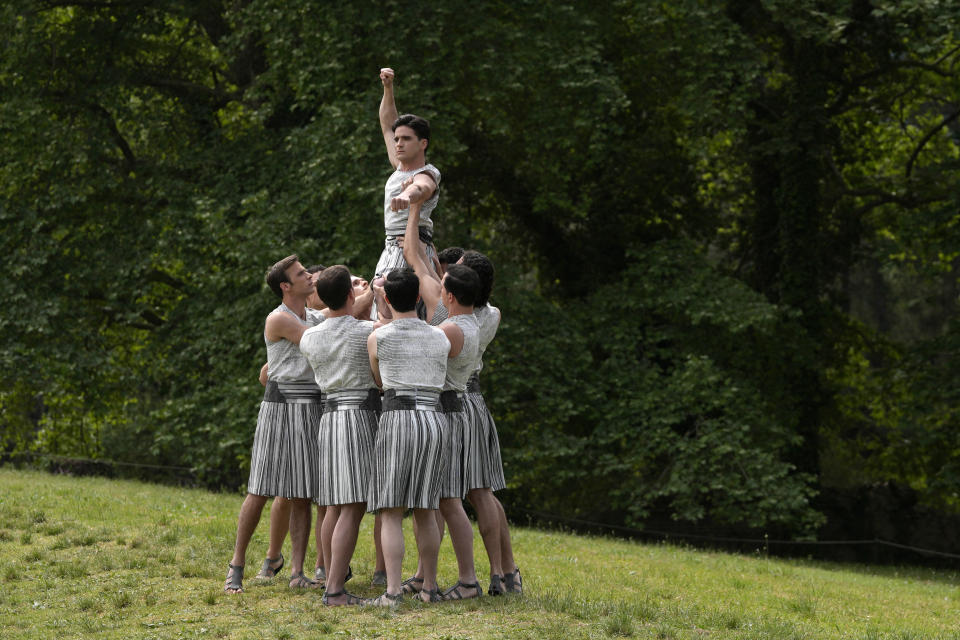 Performers take part in the official ceremony of the flame lighting for the Paris Olympics, at the Ancient Olympia site, Greece, Tuesday, April 16, 2024. The flame will be carried through Greece for 11 days before being handed over to Paris organizers on April 26. (AP Photo/Thanassis Stavrakis)