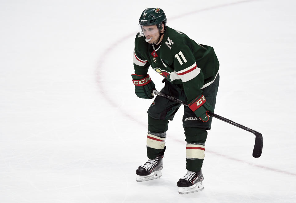 Minnesota Wild left wing Zach Parise (11) stays on the ice after losing against the Colorado Avalanche in an NHL hockey game Sunday, Feb. 9, 2020, in St. Paul, Minn. The Avalanche won 3-2. (AP Photo/Hannah Foslien)